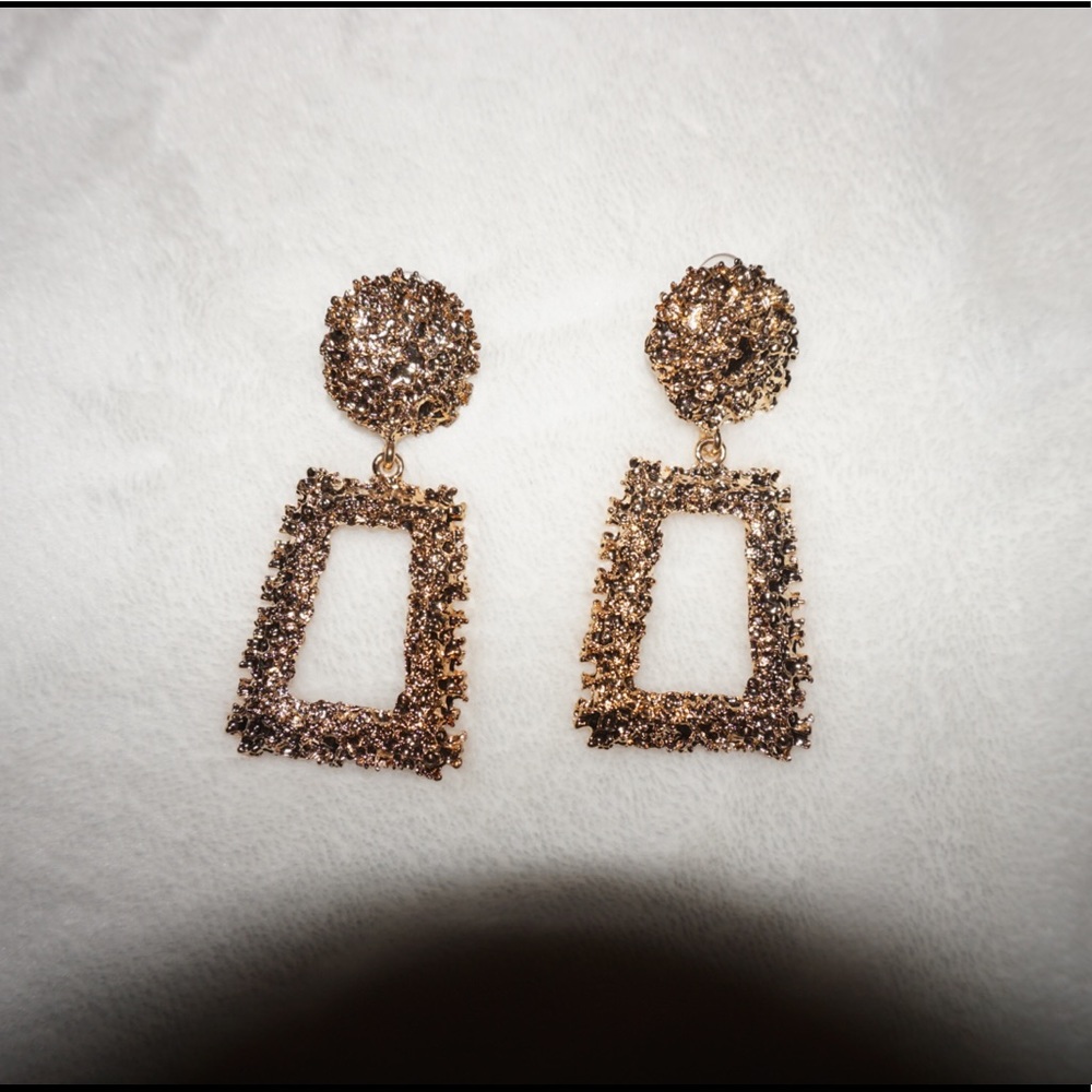 Gold stud statement earrings